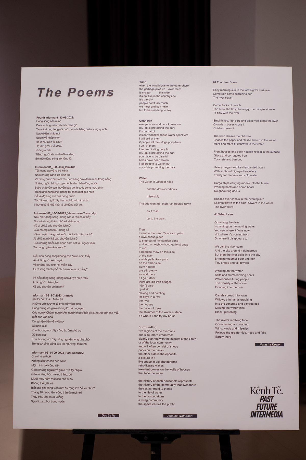 A white canvas poster with poems printed in rows. 