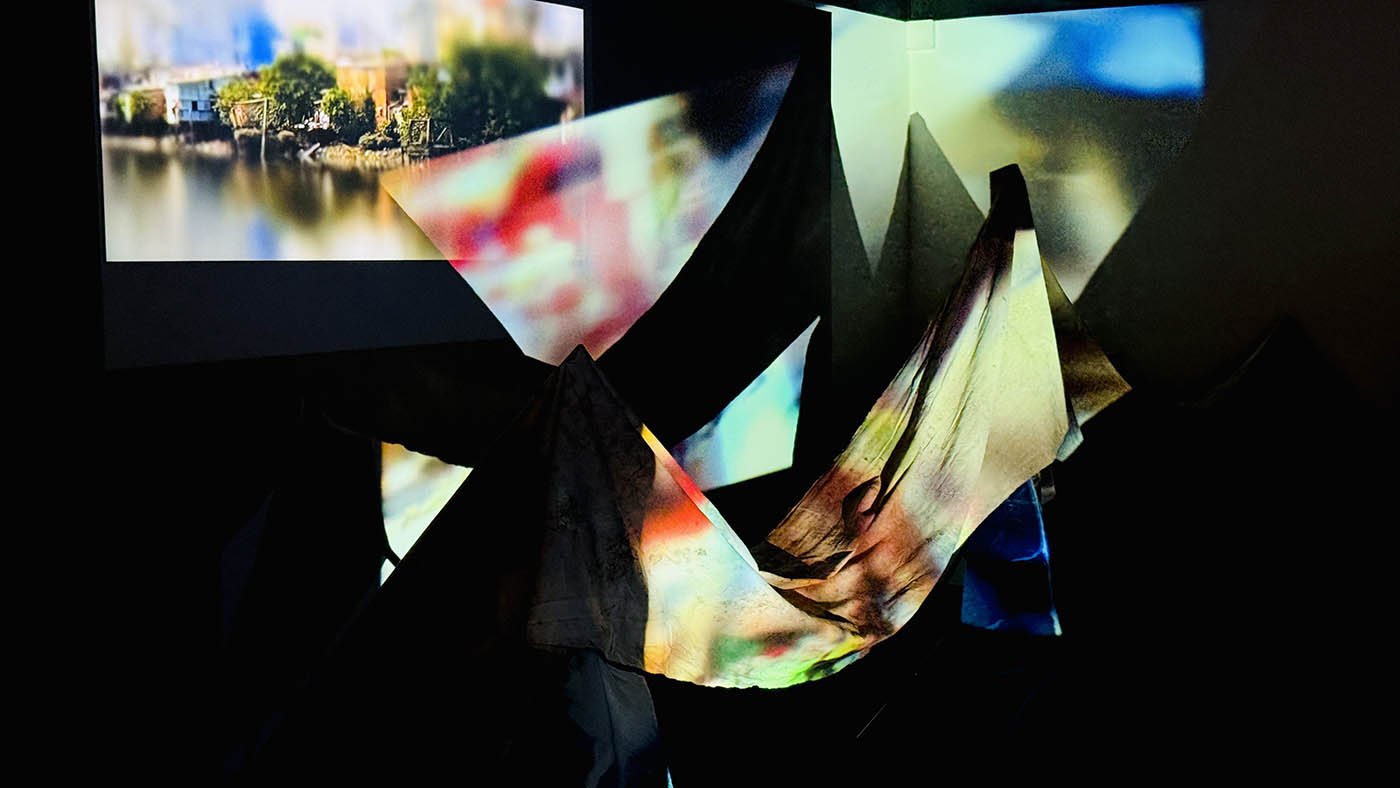 Figure 1: Video projection across the 28 x 1m calico, which was stained in sections by dipping it into the canal.